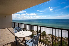 Outdoor dining - Overlooking the Beach! Private Beachfront Balcony, Pool, Hot Tub, Grill, Walk to Nearby Restaurants (Madeira Beach)