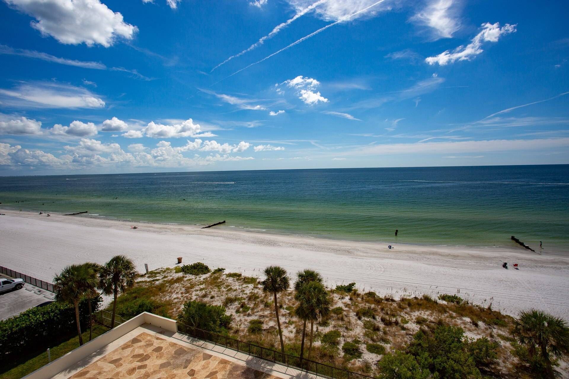 A beach with clear skies and calm waters.