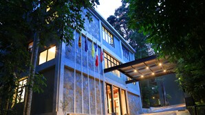 A modern building with large windows and a covered entrance. - The Spring Villas (Kandy)
