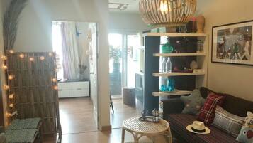 Design Suite, 1 Bedroom, Refrigerator & Microwave | Living area | TV