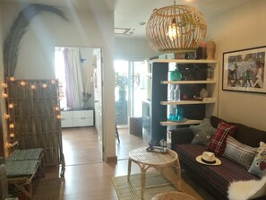 Design Suite, 1 Bedroom, Refrigerator & Microwave | Living area | TV