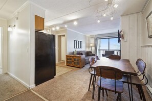Open Dining Area - The dining space offers comfortable seating for meals, games, and gathering after a day of mountain activities.