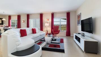 Een flatscreentelevisie, tafelvoetbal en een tafeltennistafel