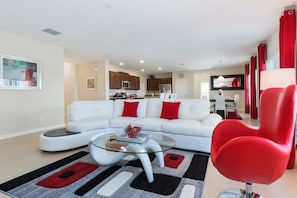 Relax in this stylish living room with a sofa, coffee table, and armchair.