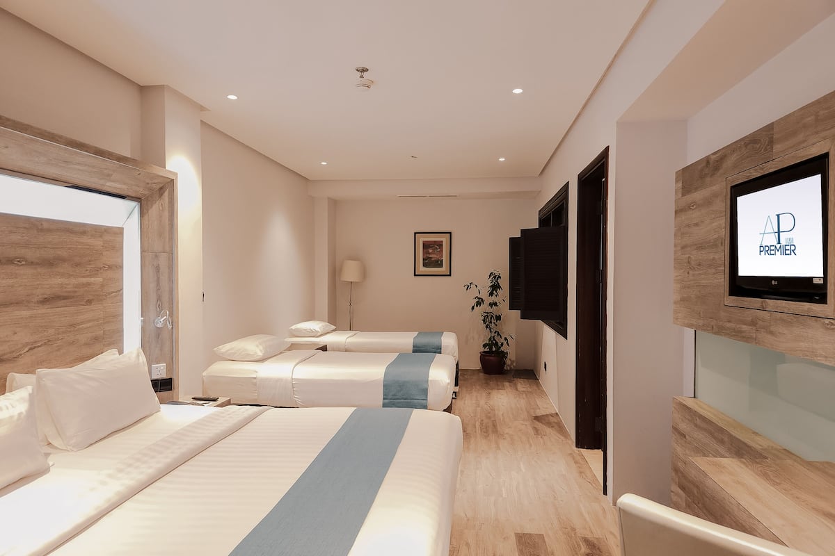 quad room | 1 bedroom, in-room safe, desk, blackout curtains