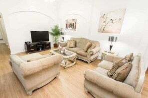 Flat-screen TV, video games, DVD player, table football