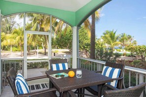 Outdoor dining - On the Bay #103 Ocean Front Condo on Northside (Old Man Bay)