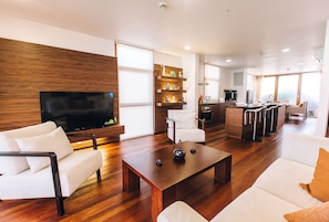 55-inch flat-screen TV with cable channels, TV