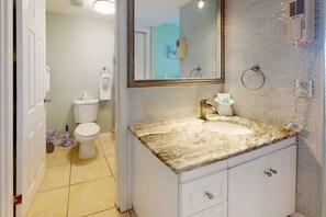 Shower, rainfall showerhead, hair dryer, towels