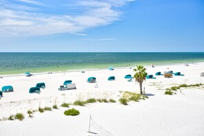 On the beach, beach towels, motor boating - Beachfront Studio Condo. Heated Pool.  Perfect Views From Private Balcony. (Treasure Island)