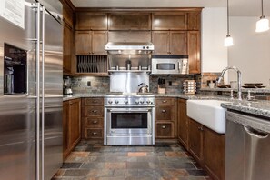 Enjoy cooking in this well-equipped kitchen with a refrigerator, microwave, dishwasher, oven, and stovetop.