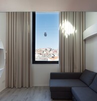 Deluxe Duplex, 1 Bedroom, River View | Living room | 50-inch flat-screen TV with cable channels, TV