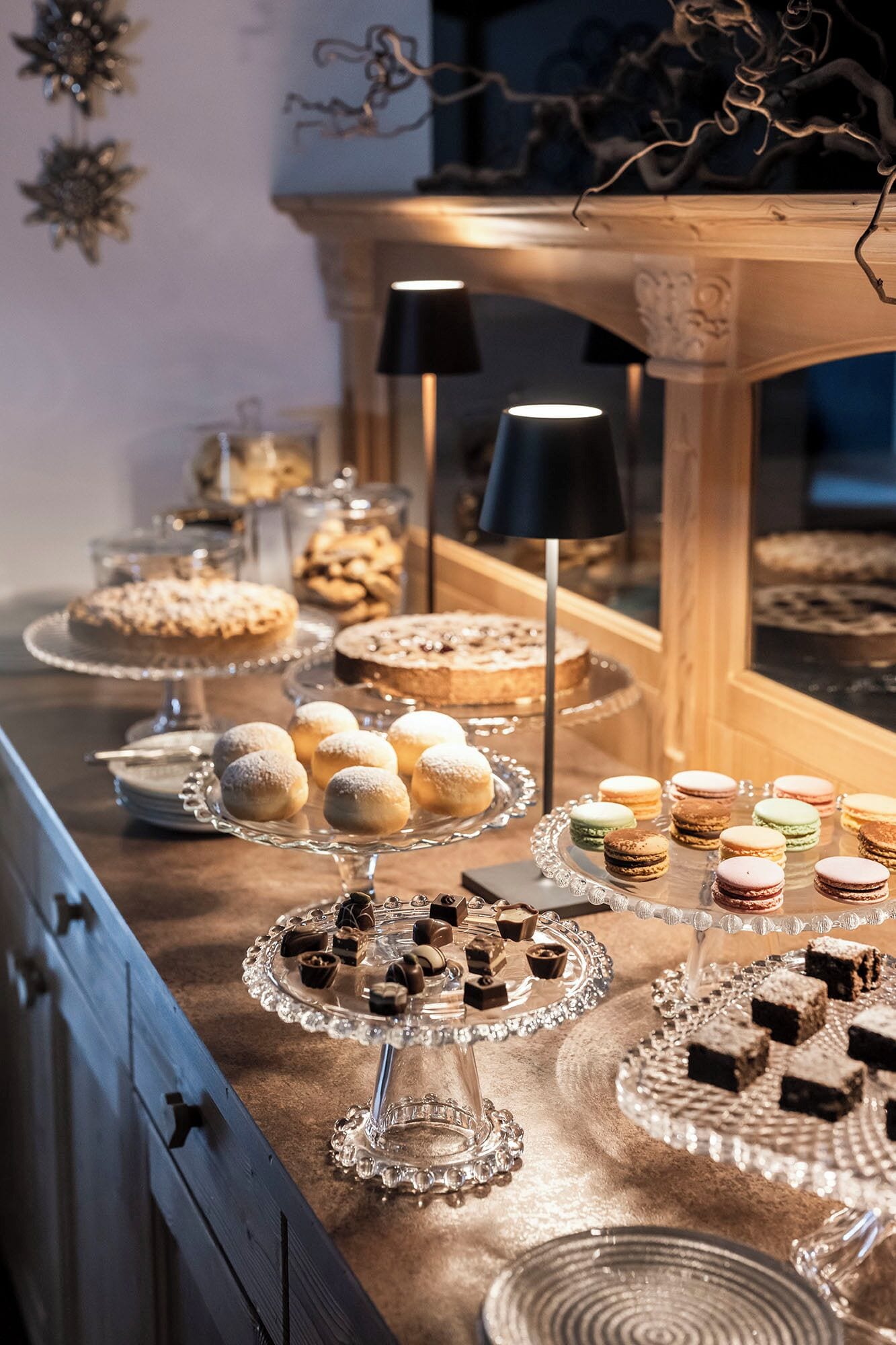 A buffet table with various desserts and pastries.