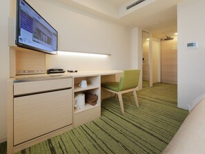 A hotel room with a desk, chair, and a television displaying a property listing. - Keio Presso Inn Gotanda (Tokyo)