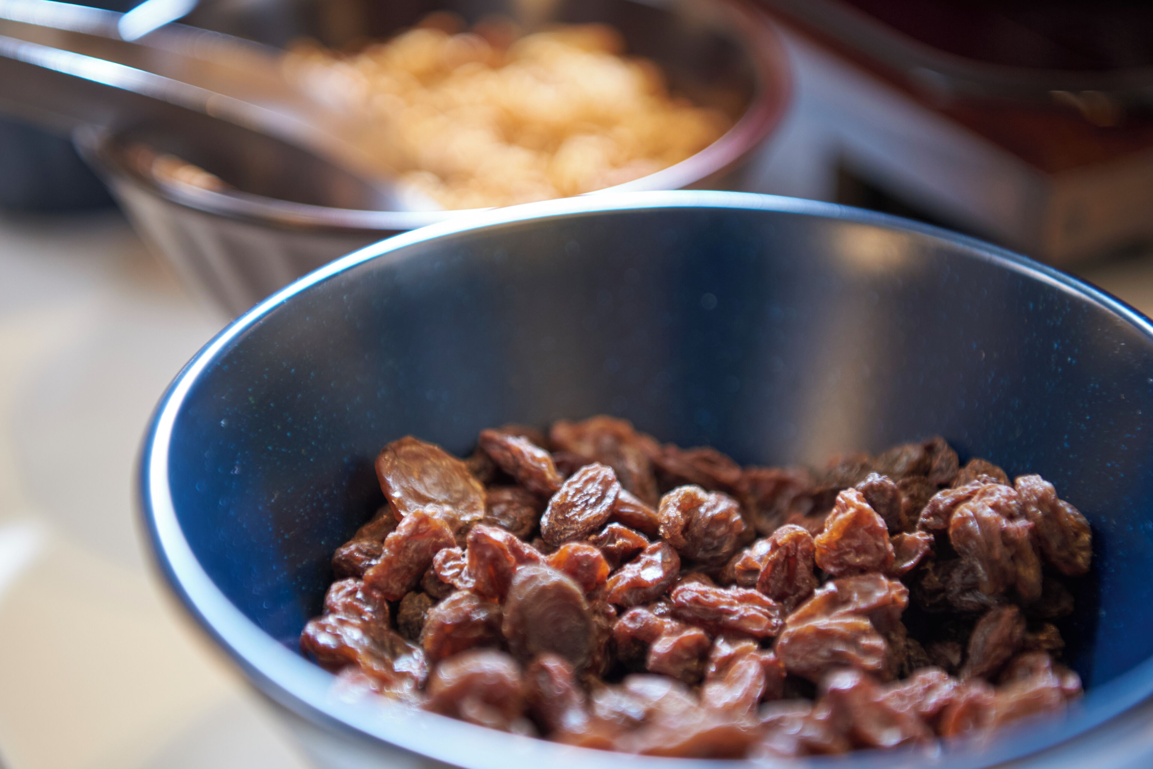 A close-up of a bowl containing dried fruits.