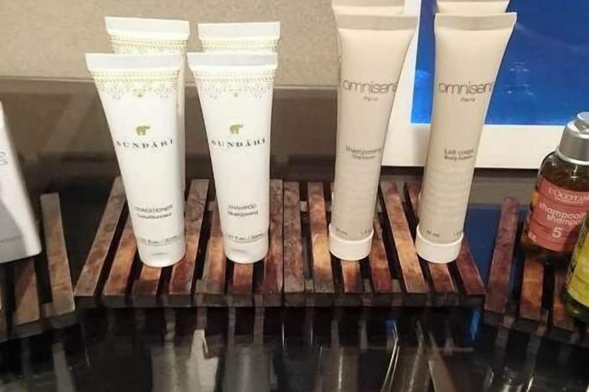 A display of skincare products on a wooden rack.