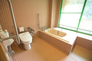 A bathroom with a toilet, sink, and bathtub. There is a window with blinds. - Hotel Tango Okoku (Kyotango)