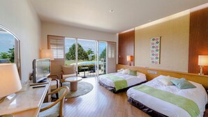 A hotel room with two beds, a desk with a computer, a chair, and a view of the outdoors. - Southern links resort hotel (Yaese)