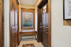 Welcoming Entryway - A built-in bench provides a convenient place to sit while taking off boots after a day on the mountain.