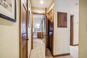 Hallway Connecting the Bedrooms - The hallway provides easy access to the bedrooms, bathrooms, and main living area.