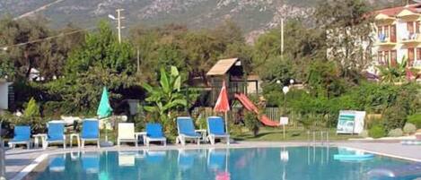 Outdoor pool, open 8:00 AM to 8:30 PM, pool loungers