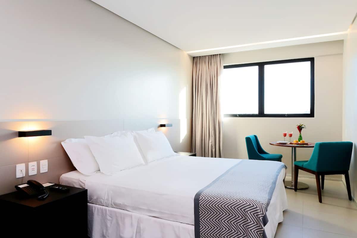 premium double room, 1 king bed | minibar, in-room safe, desk, blackout curtains