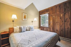 Comfortable Guest Bedroom - This inviting bedroom offers a peaceful retreat with warm mountain charm and a comfortable bed for a restful night's sleep.