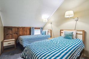 Twin Guest Bedroom - Perfect for family or friends, this bedroom features two comfortable twin beds in a bright, inviting setting. - 3-Bedroom Whiffletree Condo E8 with Ski-Home Trail & Weekend Shuttle (Killington)