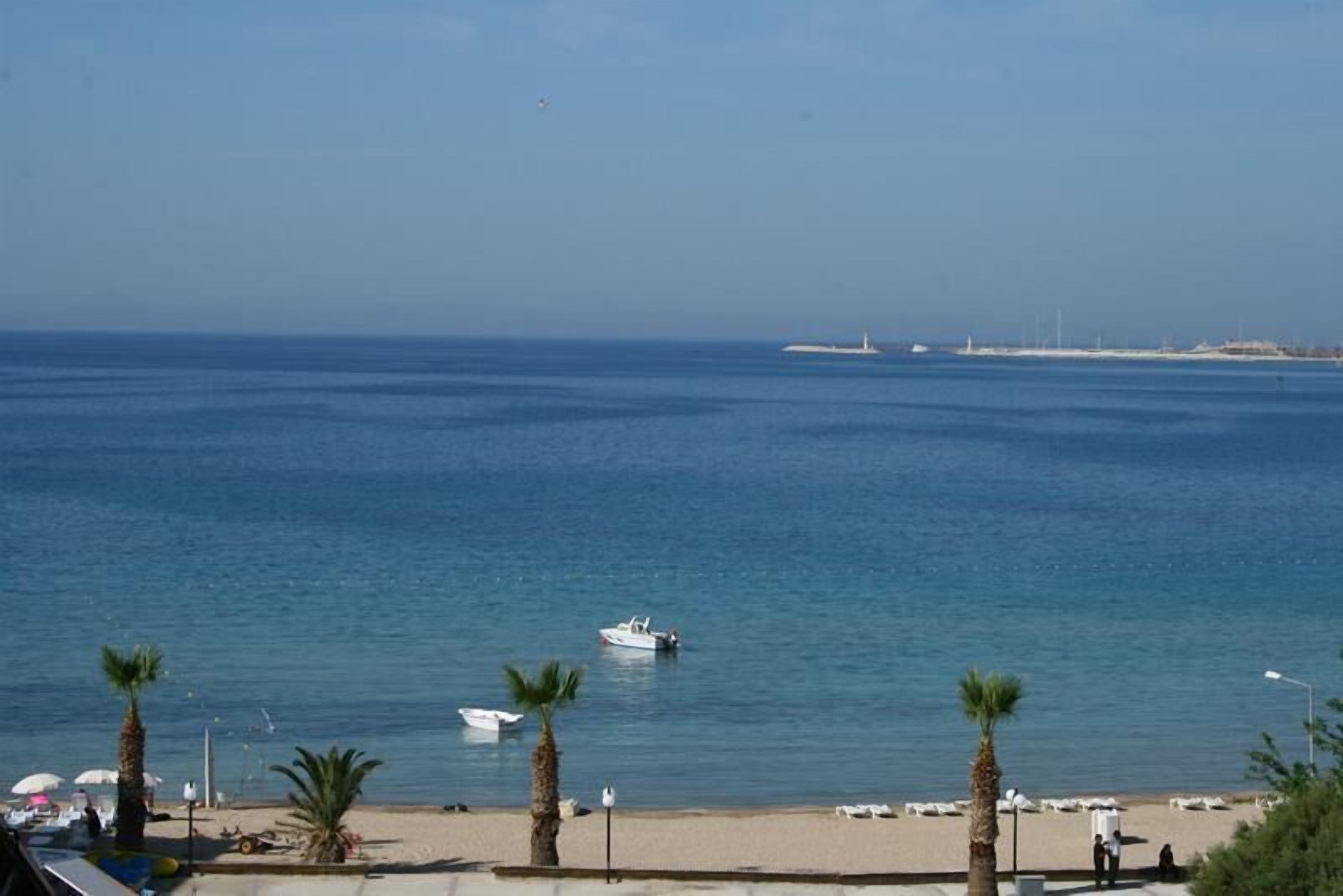 On the beach, sun-loungers, beach umbrellas