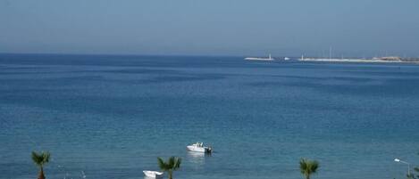 On the beach, sun loungers, beach umbrellas