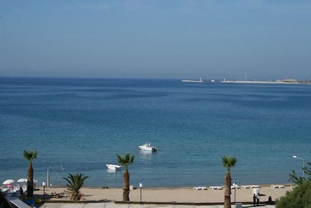 On the beach, sun-loungers, beach umbrellas