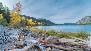Escape to a serene lakeside haven surrounded by forested hills, perfect for relaxation and outdoor activities.