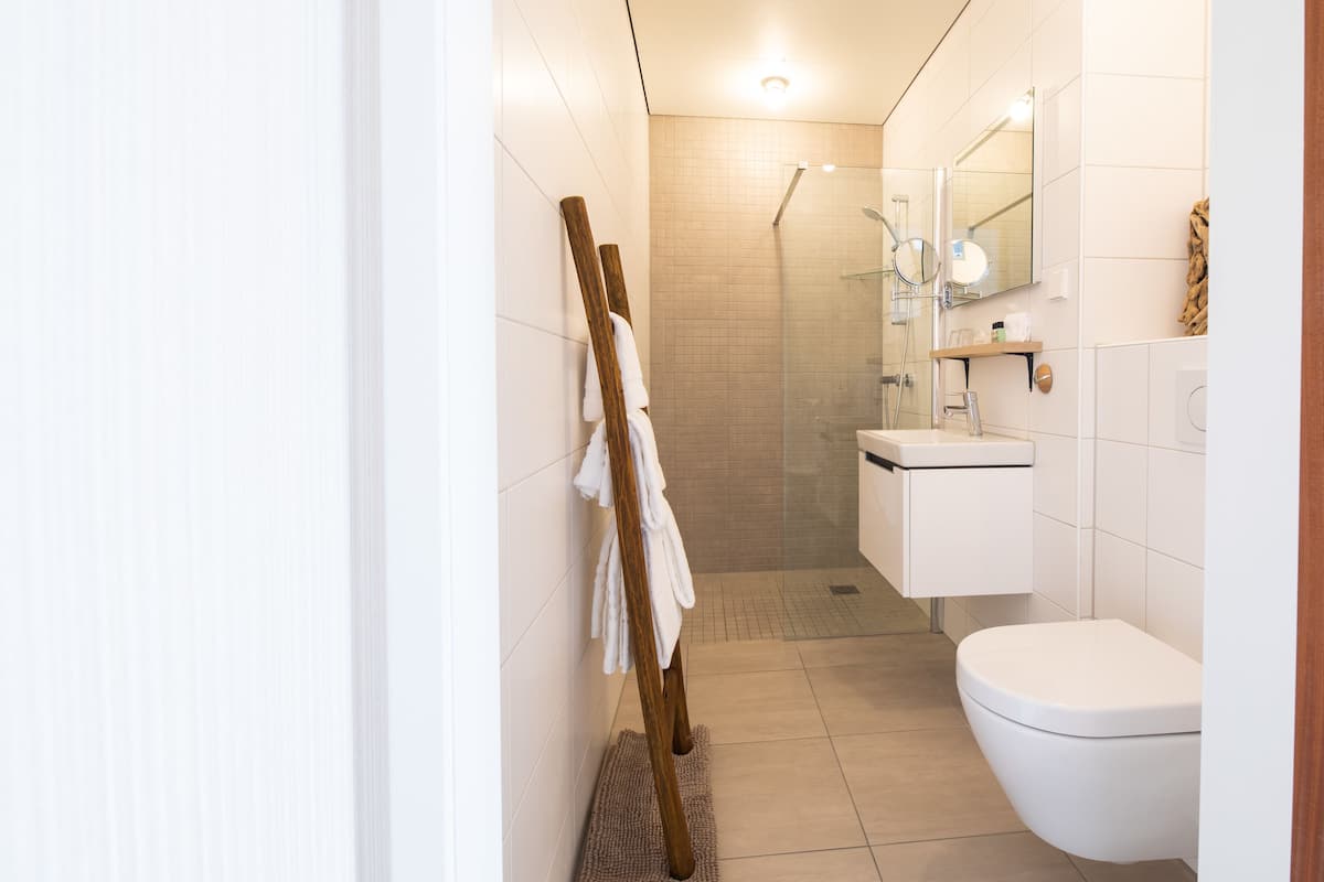 designer toiletries, hair dryer, bathrobes, towels