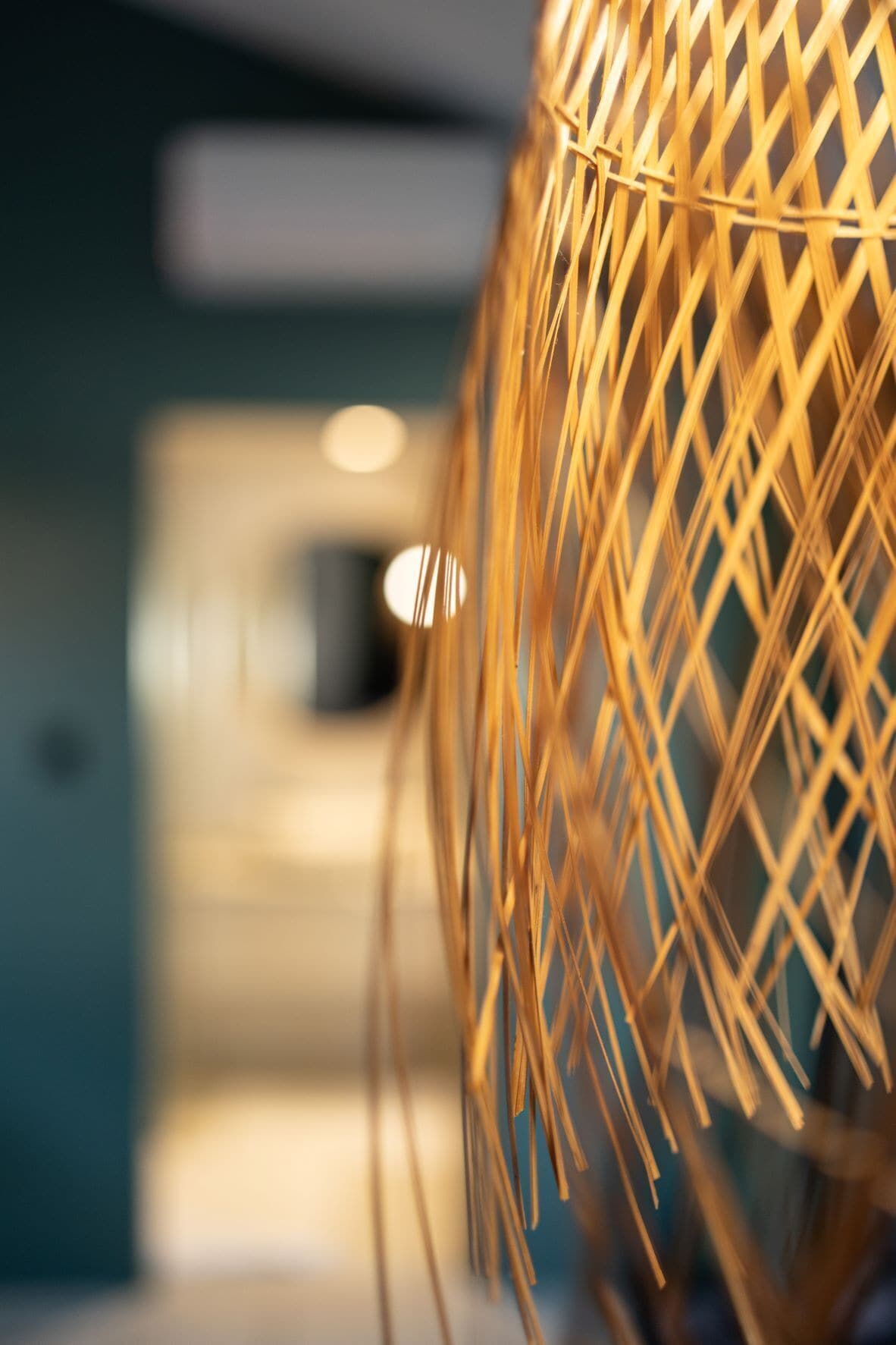 A close-up of a woven, spherical object with a blurred background.