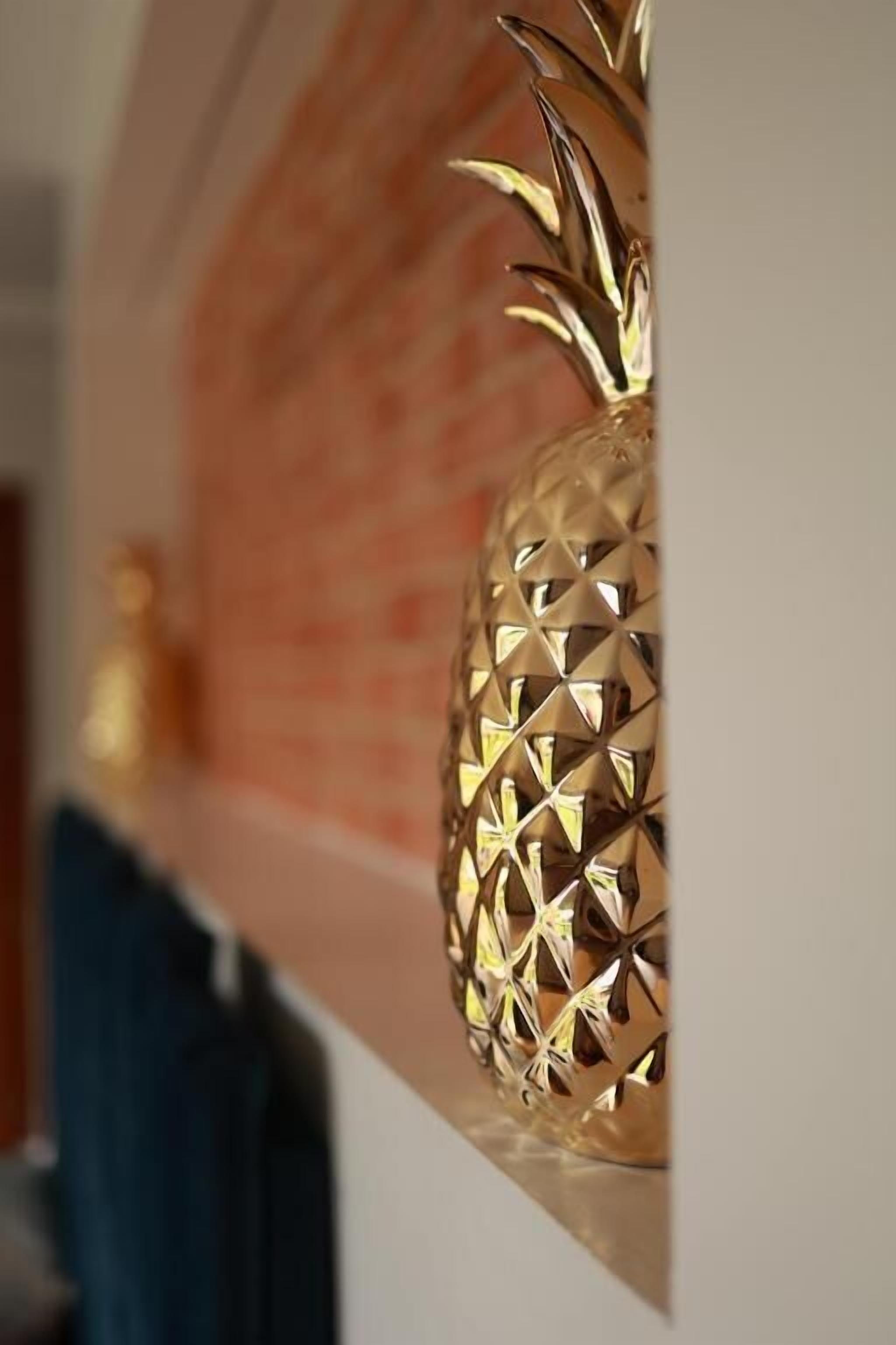 A close-up of a pineapple-shaped decoration with a textured surface.