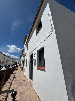 Walking through historic streets lined with traditional buildings.