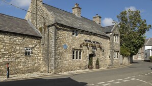 A stone building with a sign reading "Old Swan Inn". - Ariel, Marcross, Llantwit Major , Vale of Glamorgan, Wales (Marcross)