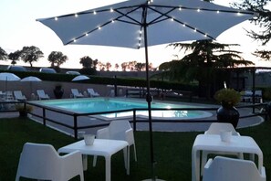 Seasonal outdoor pool, pool umbrellas, pool loungers