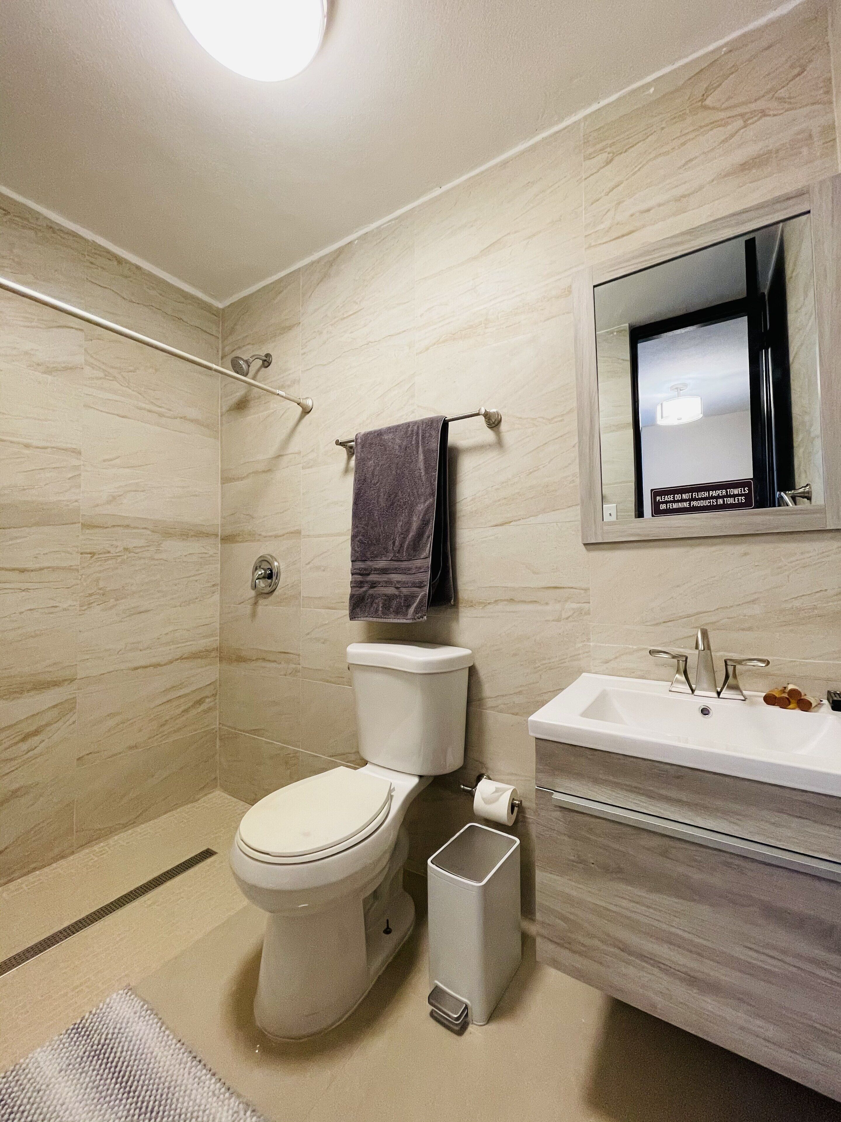 Shower, hair dryer, towels, shampoo