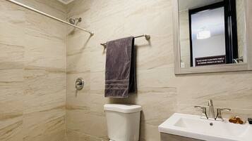 Shower, hair dryer, towels, shampoo
