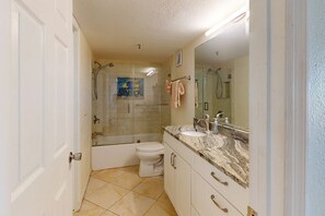 Shower, hair dryer, towels, shampoo