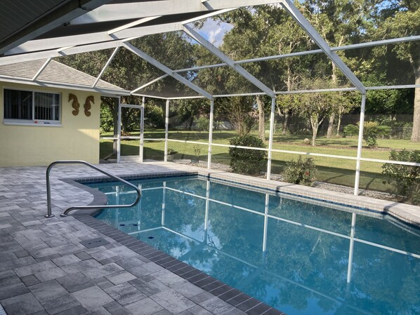 A heated pool, pool loungers