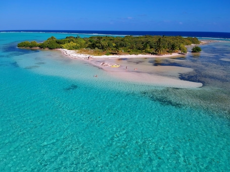 Sun-loungers, beach towels. Little Cayman 3 Bedroom Oceanfront Private Villa