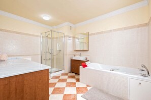 Bathtub, hair dryer, towels, soap