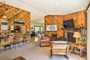 TV, fireplace, books, music library