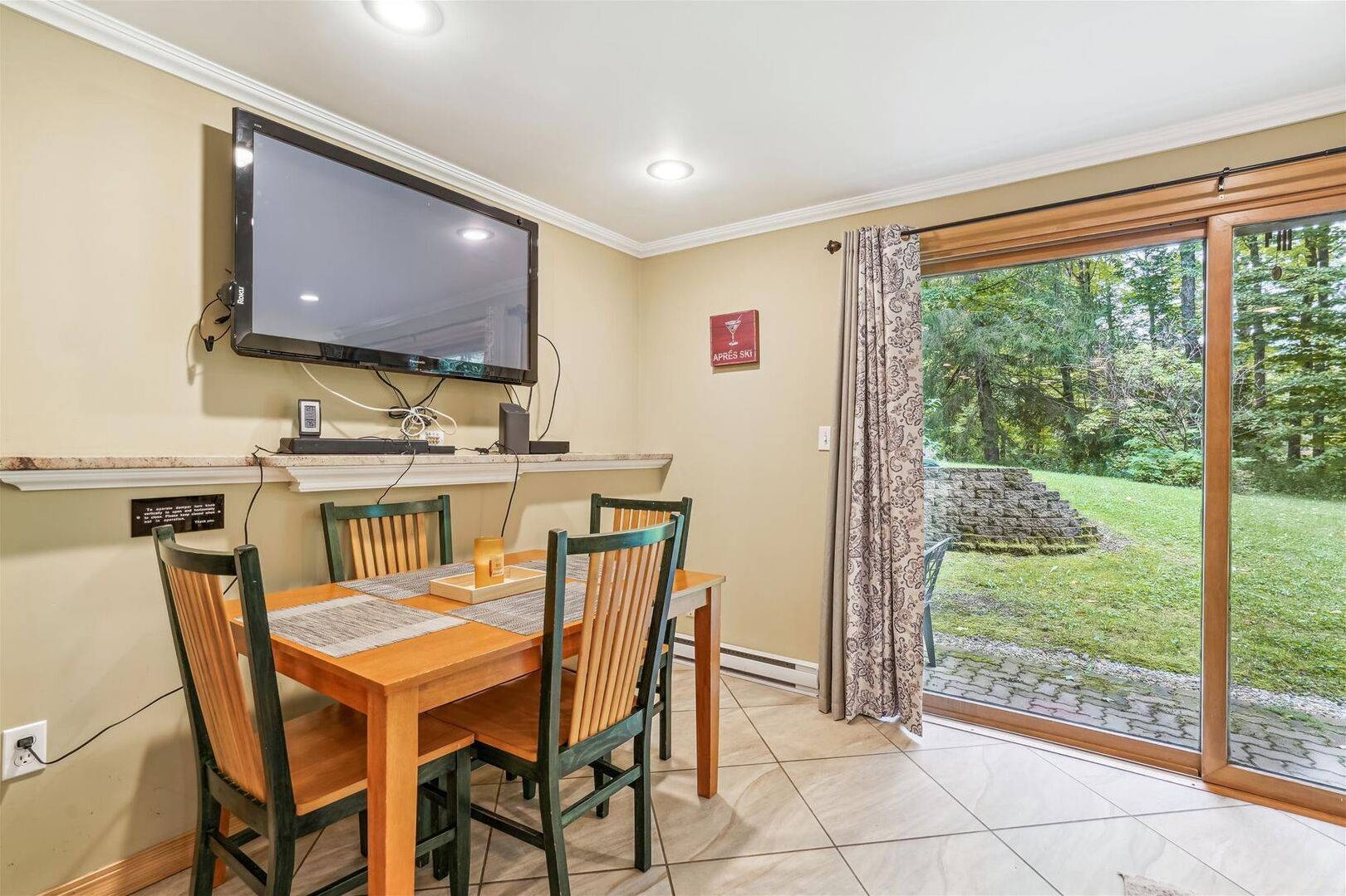Dining Area - Dine indoors while enjoying views of the surrounding greenery, or step outside to take in the fresh Vermont air.