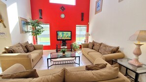 Een televisie, een dvd-speler, boeken en een stereo