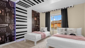 A hotel room with two beds, a window with curtains, a striped wall, and a carpeted floor. - 4 Bedrooms / 3 Bathrooms / Paradise Palms (8925 BP) (Kissimmee)