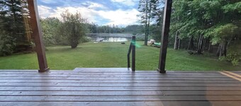 Lakefront, covered deck, huge backyard with grill, swimming, boat & kayaks! 