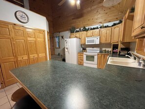 Fridge, microwave, oven, stovetop - Lakefront, covered deck, huge backyard with grill, swimming, boat & kayaks!  (Wetmore)